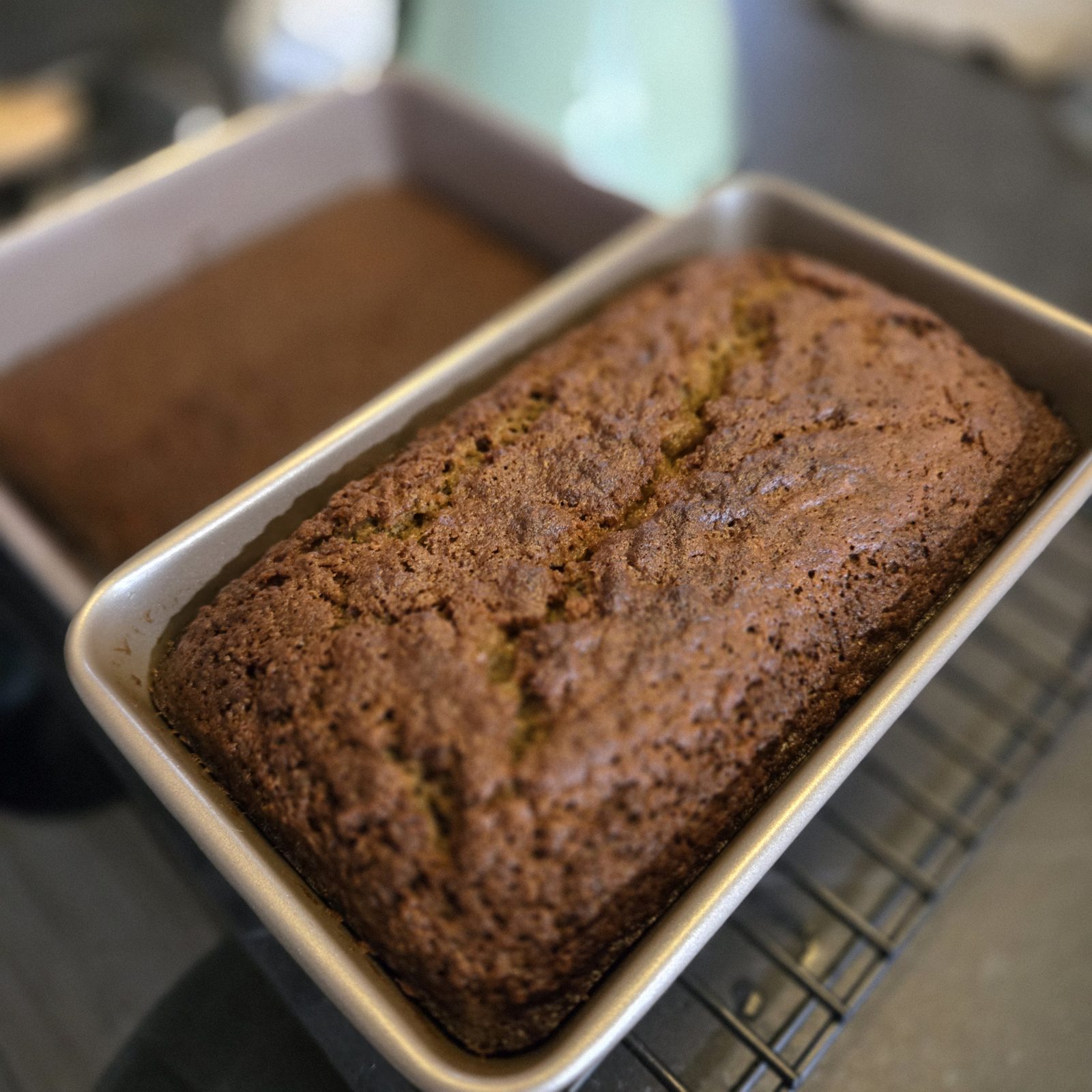 A freshly baked loaf cake in its tin